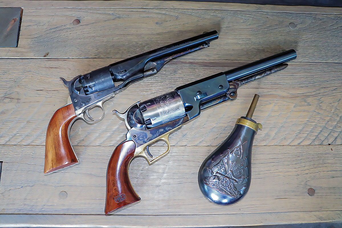 The Walker Colt (by Cimarron Firearms) contrasted with the 1860 Army replica (left).